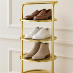 Détail des plateaux ronds ajourés et de l'arceau-poignée du range-chaussures doré